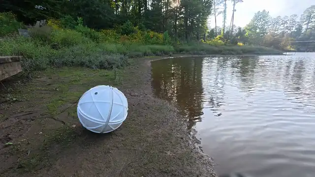 MARBLE rolling from land into water